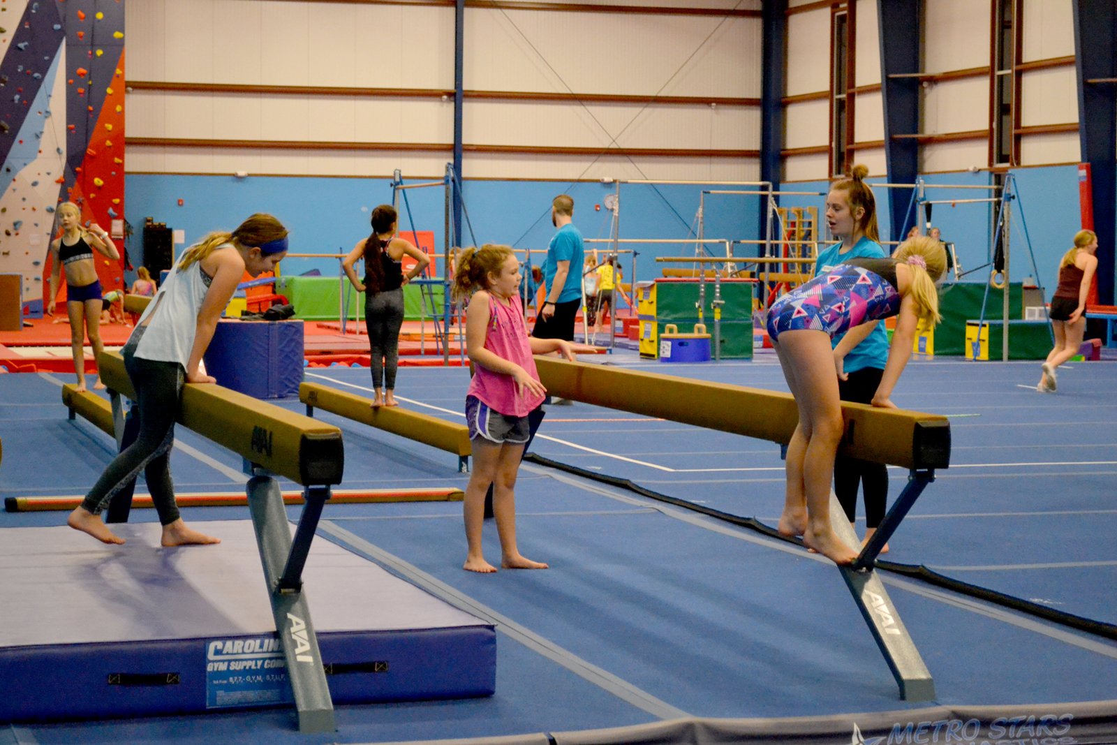 Metro Stars gymnastics facility featuring balance beams and training equipment
